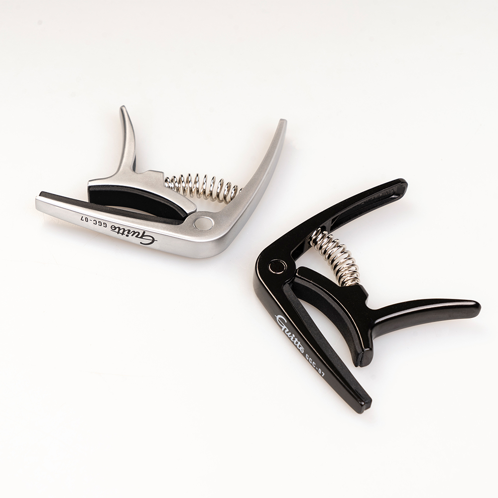 GUITTO GGC-07 Ukulele Capo Qui - مراجعة Musical Instrument In English وسعره